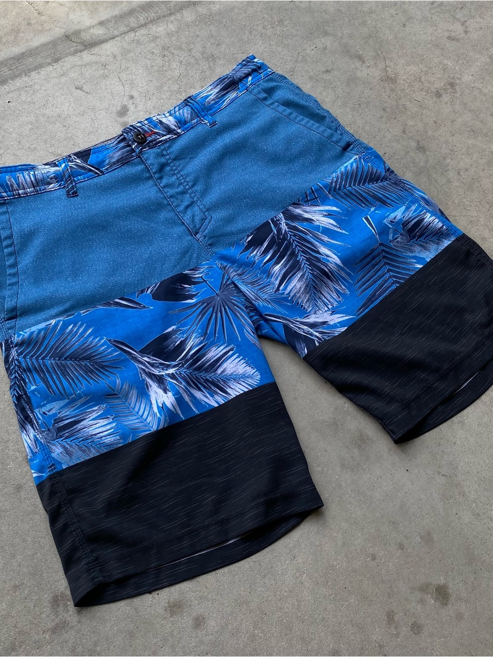 Vintage O’Neill blue and black with palm tree pattern board shorts